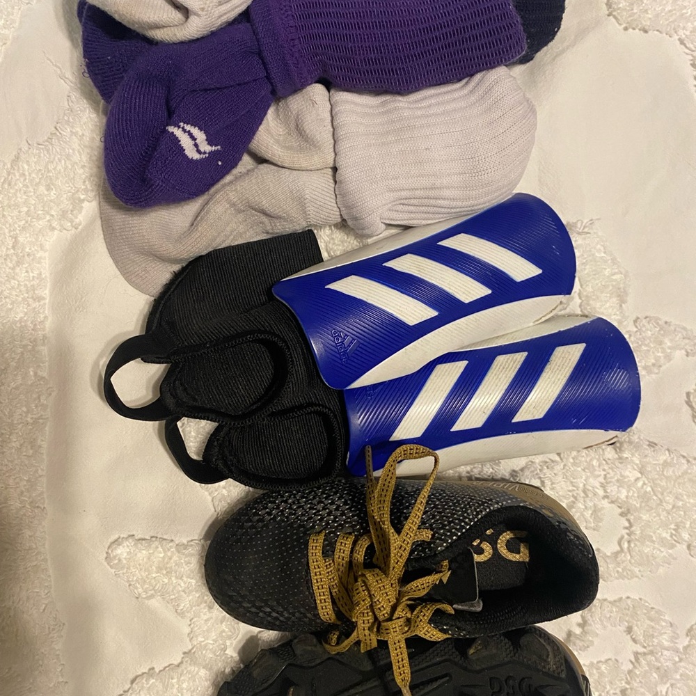 Adidas Blue Shin Guards with soccer cleats
